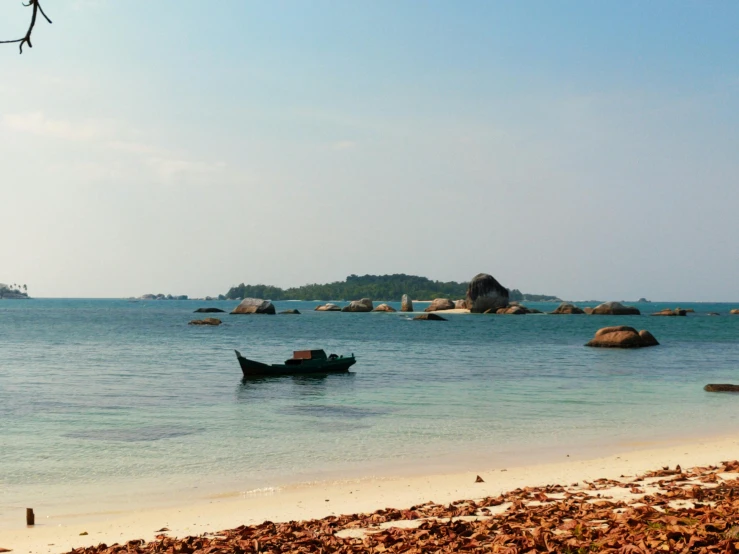 a boat sitting on top of a beach next to the ocean, many islands, medium format, indiecraft aesthetic, malaysian