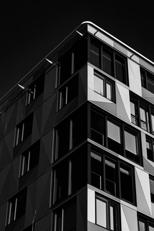 a black and white photo of a tall building, unsplash, modular constructivism, square, contrast colors, faceted, dark and white