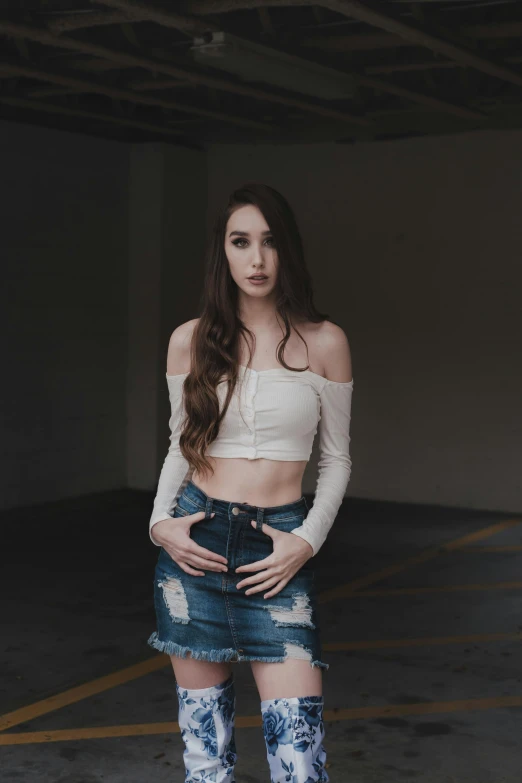 a woman standing on a skateboard in a parking garage, an album cover, inspired by Elsa Bleda, trending on pexels, renaissance, wearing a sexy cropped top, 15081959 21121991 01012000 4k, young woman with long dark hair, tight wrinkled cloath