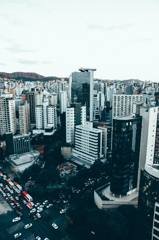 a city filled with lots of tall buildings, by Lucas Vorsterman, pexels contest winner, oscar niemeyer, low quality photo, small buildings, panoramic