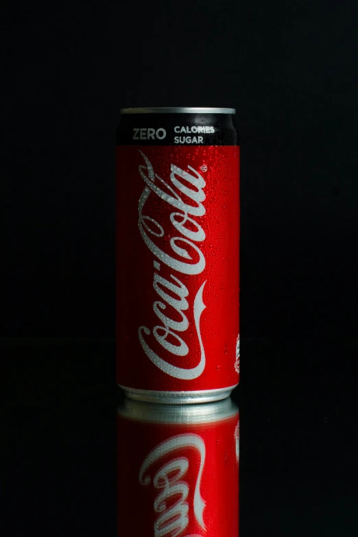 a can of coke sitting on top of a table, by Ben Zoeller, pexels, hyperrealism, standing with a black background, promo image, 240p, cane