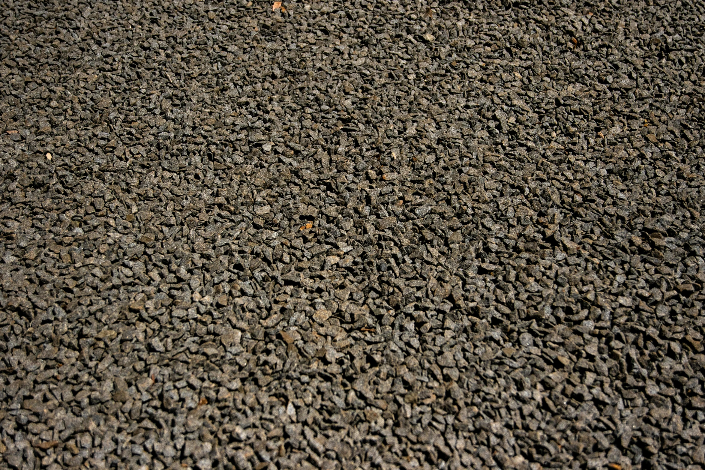 a red fire hydrant sitting on top of a pile of rocks, by Jason Felix, reddit, high resolution coal texture, 3 mm, black sand, ultrafine detail ”