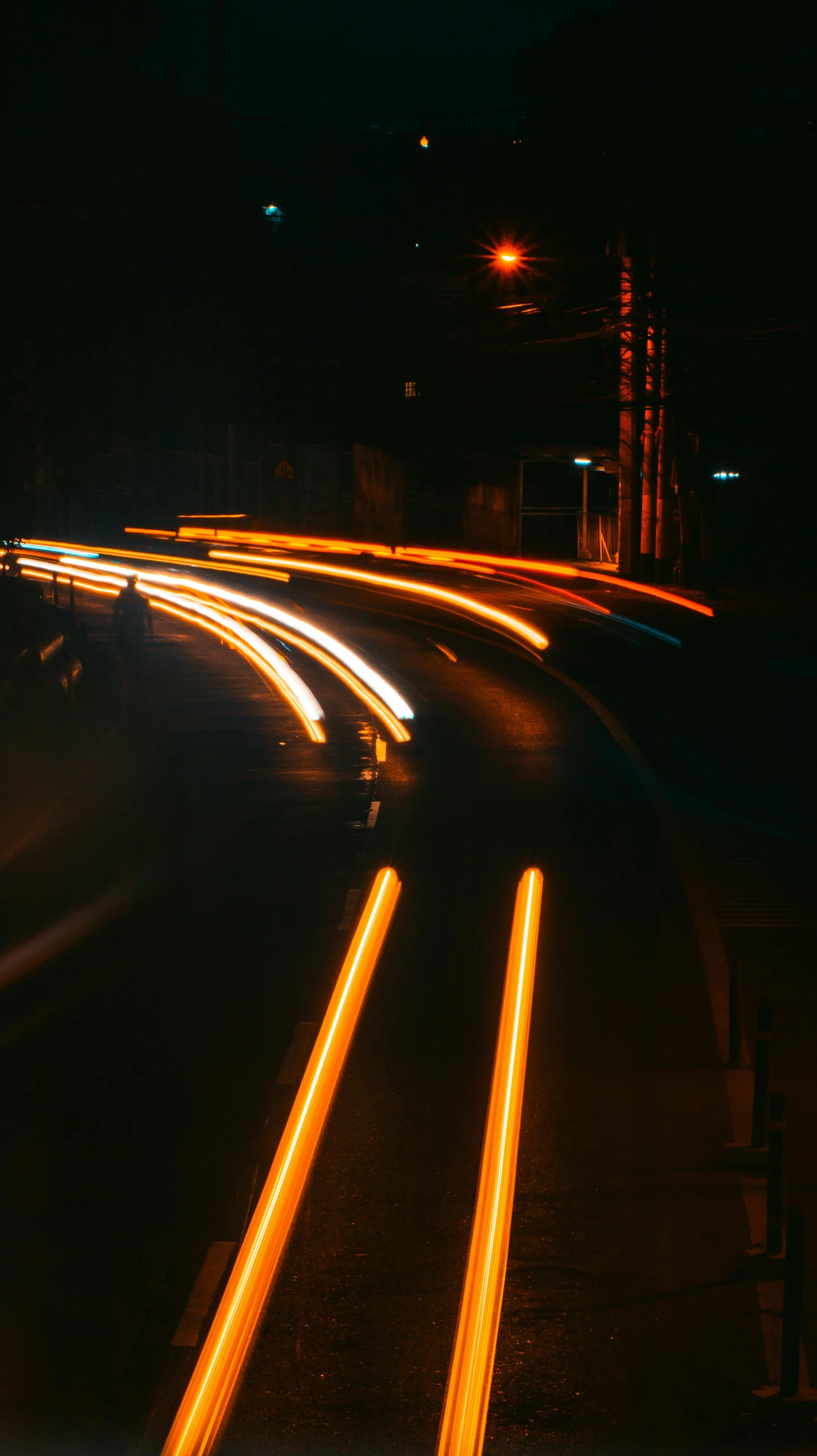 a city street filled with lots of traffic at night, an album cover, unsplash, fujicolor superia photo, lines of energy, orange electricity, curving