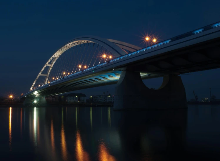 a bridge over a body of water at night, by Jacob Toorenvliet, pexels contest winner, hyperrealism, calatrava, wim crouwel, high quality photo, medium format. soft light