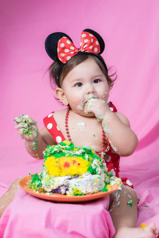 a little girl that is sitting in front of a cake, an album cover, by disney, pexels, studio portrait photo, eating, alanis guillen, softplay