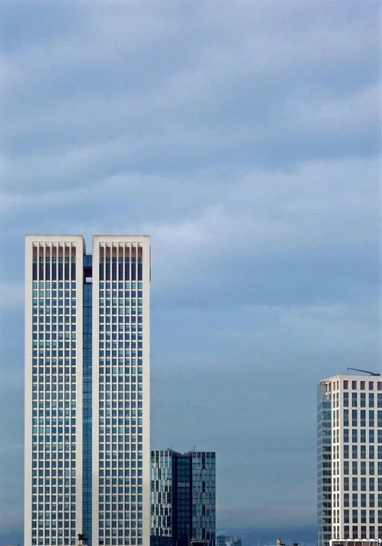 a couple of tall buildings sitting next to each other, a picture, inspired by David Chipperfield, unsplash, rostov, warsaw, gigapixel photo, 2 0 0 4 photograph