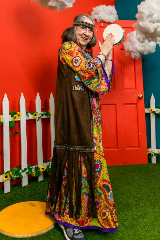 a man that is standing in the grass with a frisbee, inspired by Ford Madox Brown, maximalism, wearing rainbow kimono, profile image, brown, lady with glowing flowers dress