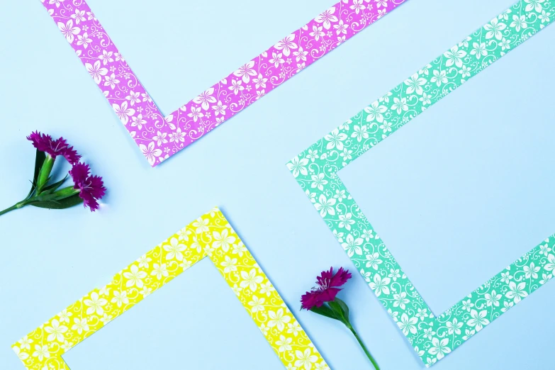 a bunch of flowers sitting on top of a table, pexels contest winner, color field, paper border, patterned, paper decoration, flat colour