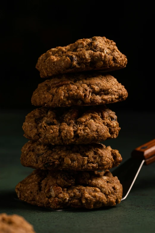 a stack of cookies sitting on top of a table, renaissance, thumbnail, frontal shot, award winning dark, handcrafted