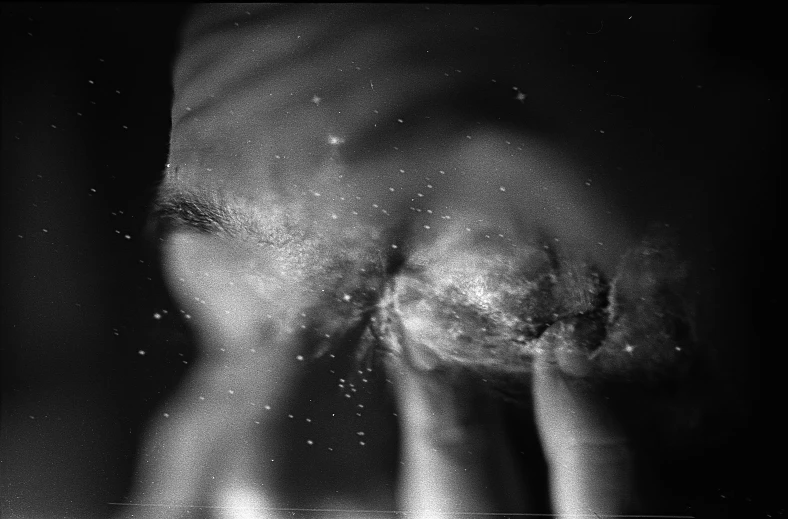 a black and white photo of a person's face, a stipple, by Jan Rustem, conceptual art, visible stomach, sparkles, closeup of fist, holga 120n