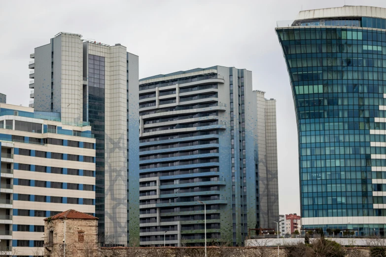 a group of tall buildings sitting next to each other, ayanamikodon and irakli nadar, exterior photo, uhq, georgic
