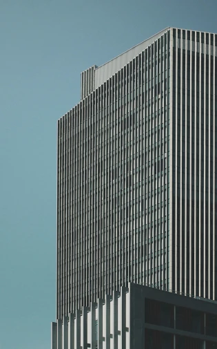 a plane flying in front of a tall building, an album cover, inspired by David Chipperfield, unsplash, brutalism, square lines, high quality photo, united nations, aluminum
