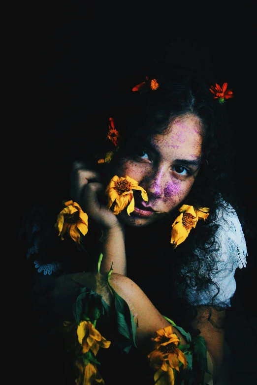 a woman holding a bunch of sunflowers in front of her face, an album cover, inspired by Elsa Bleda, pexels contest winner, in a black room, woman portrait made out of paint, sitting with flowers, justina blakeney