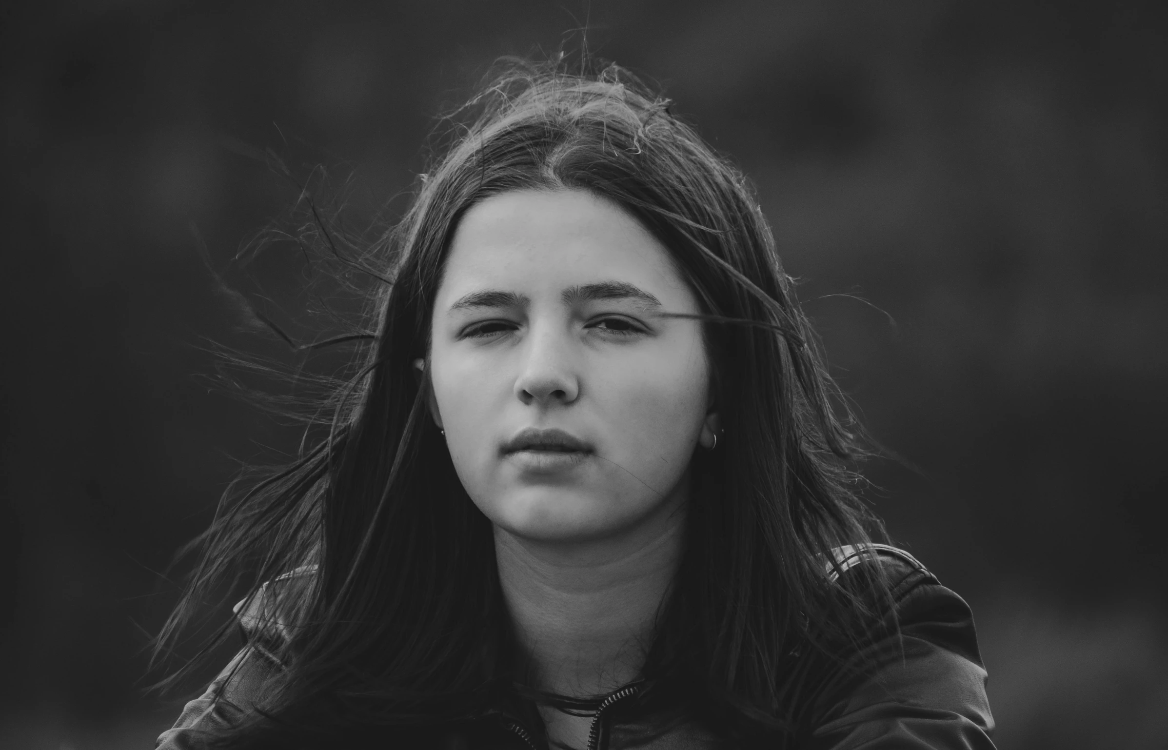 a black and white photo of a woman with long hair, pexels contest winner, realism, portrait of normal teenage girl, f / 1. 9 6. 8 1 mm iso 4 0, skye meaker, windblown dark hair