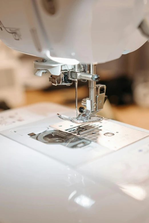a close up of a sewing machine on a table, inspect in inventory image, embroidered robes, digital image, product shot