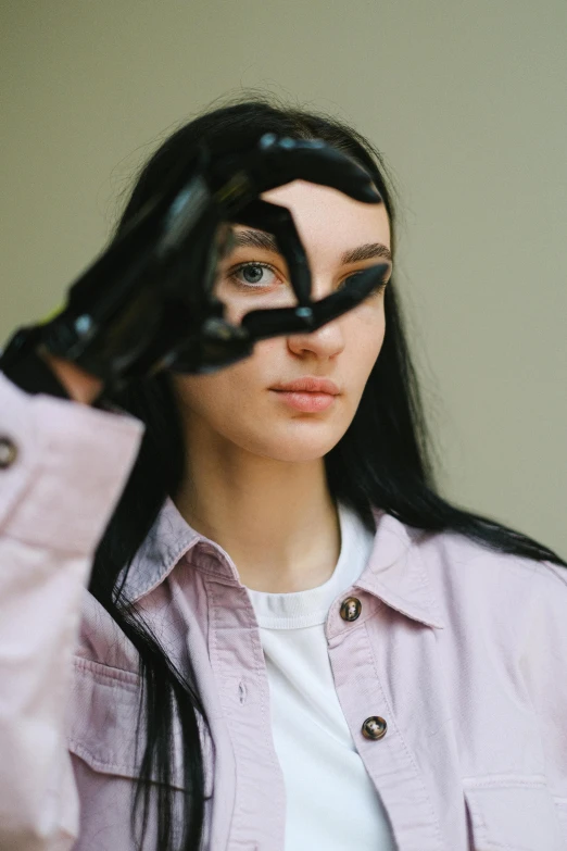 a woman holding a pair of scissors in front of her face, inspired by Hannah Frank, trending on pexels, visual art, wearing black leather trenchcoat, portrait of a teen robot, female with long black hair, non binary future world