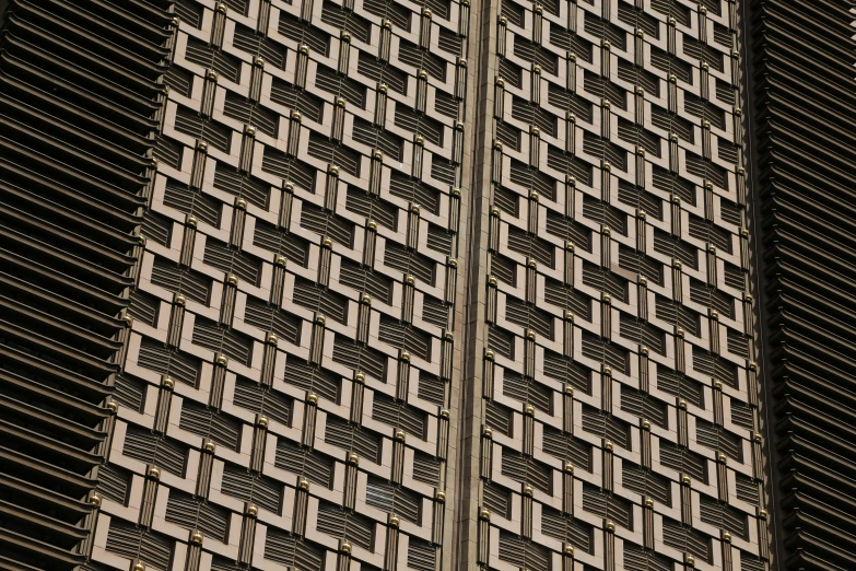 a tall building with a clock on top of it, a mosaic, inspired by Andreas Gursky, unsplash, brutalism, detailed grid as background, rows of razor sharp teeth, a pair of ribbed, macro details