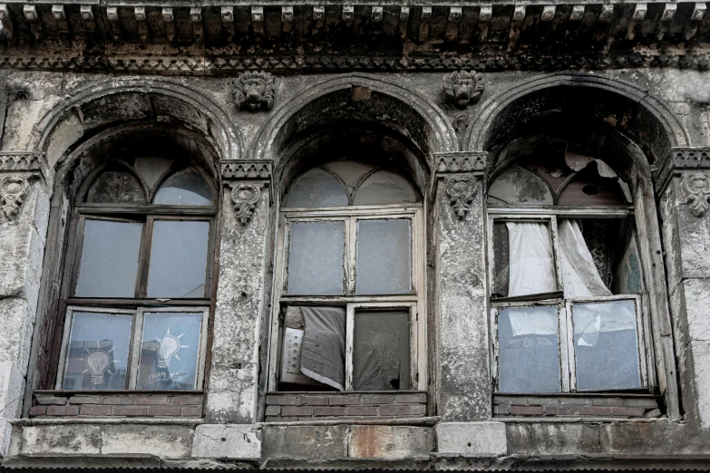 a couple of windows sitting on the side of a building, inspired by Elsa Bleda, pexels contest winner, renaissance, ornate city ruins, grey, brown, demolition