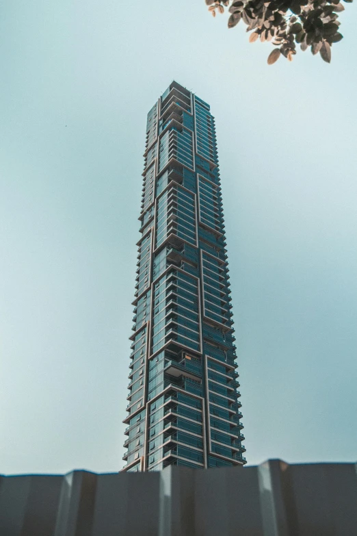 a tall building sitting in the middle of a city, in sci - fi mumbai, 3/4 side view, fan favorite, penthouse