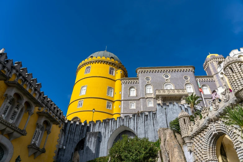 a large castle sitting on top of a lush green hillside, pexels contest winner, renaissance, yellow windows and details, oscar niemeyer, square, thumbnail