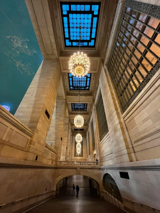 a long hallway with a skylight above it, by Greg Rutkowski, unsplash contest winner, hanging tiffany chandeliers, new york buildings, water gushing from ceiling, thumbnail