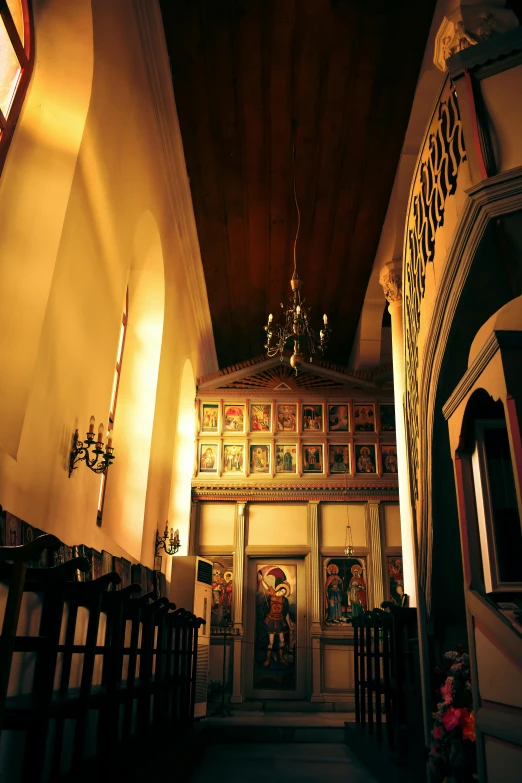 the interior of a church with stained glass windows, kalighat, narrow hallway, candlelit, taken in the late 2000s