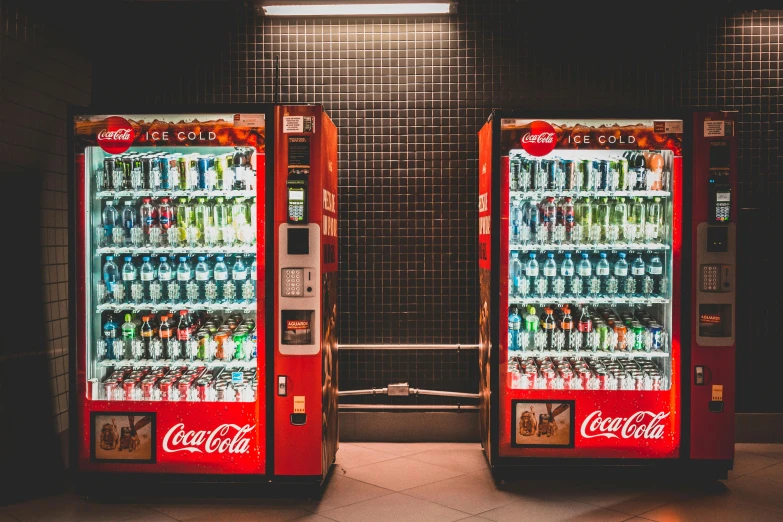 two vending machines sitting next to each other, pexels contest winner, 🦩🪐🐞👩🏻🦳, drinking a bottle of coca-cola, frank moth, innovative