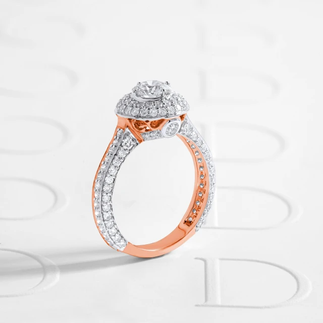 a diamond ring sitting on top of a white surface, by Daniel Gelon, boucheron, add a glow around subj. edge, rose gold, dd