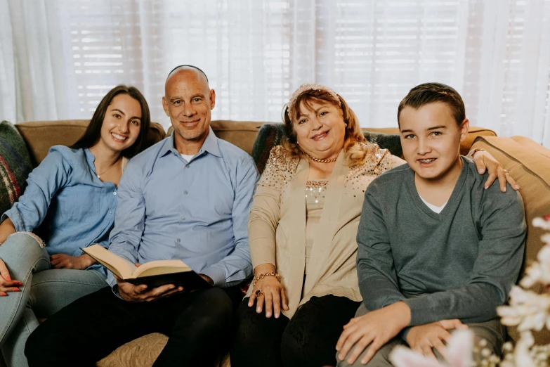 a group of people sitting on top of a couch