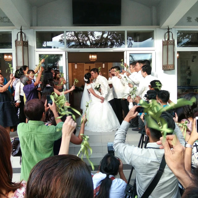 a group of people taking pictures of a bride and groom, by Elaine Duillo, flickr, happening, manila, front facing view, square, vine