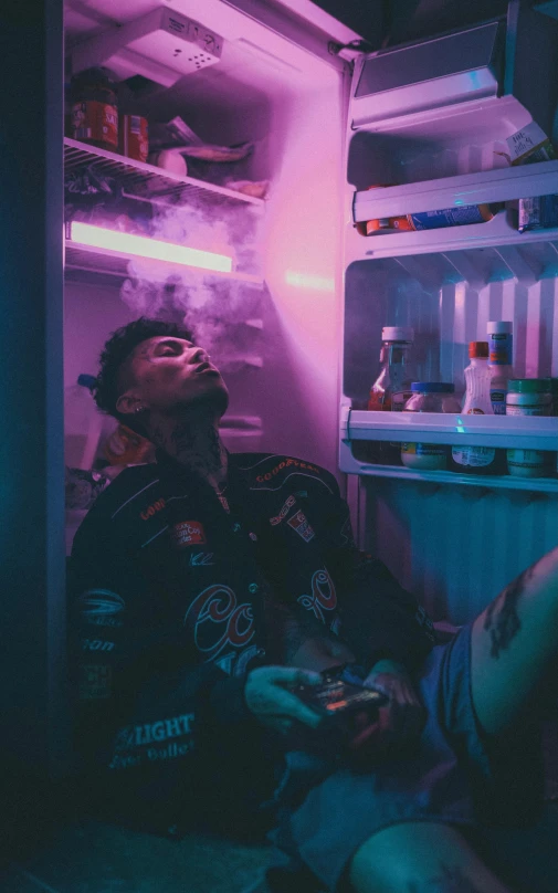a man sitting in front of an open refrigerator, inspired by Liam Wong, pexels contest winner, smoking body, lil peep, neymar, alcohol