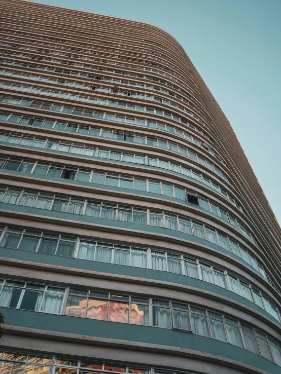 a very tall building with lots of windows, pexels contest winner, rounded lines, soviet apartment, 8k hq, wide views