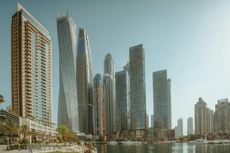 a large body of water surrounded by tall buildings, a detailed matte painting, inspired by Victor Enrich, pexels contest winner, hyperrealism, gta : dubai, curvy build, tall metal towers, seen from outside
