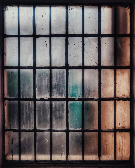 a close up of a window with bars, inspired by Elsa Bleda, trending on unsplash, grungy; colorful, translucent skin, square lines, dark and grungy