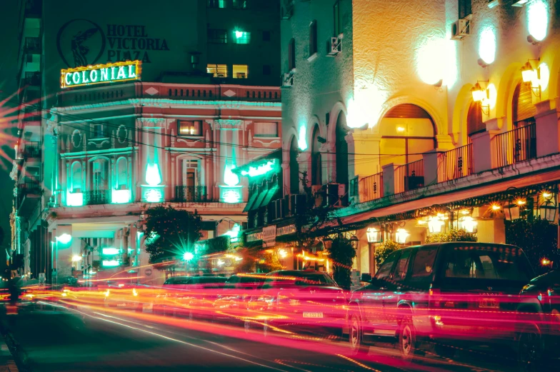 a city street filled with lots of traffic at night, pexels contest winner, art nouveau, manila, buenos aires, retro stylised, taverns nighttime lifestyle