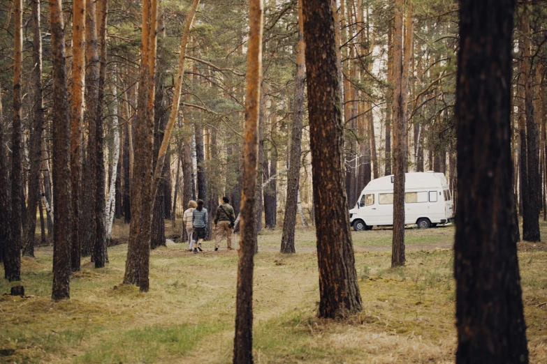 a group of people walking through a forest, by Grytė Pintukaitė, unsplash contest winner, renaissance, next to an rv, lada, 000 — википедия, suburban