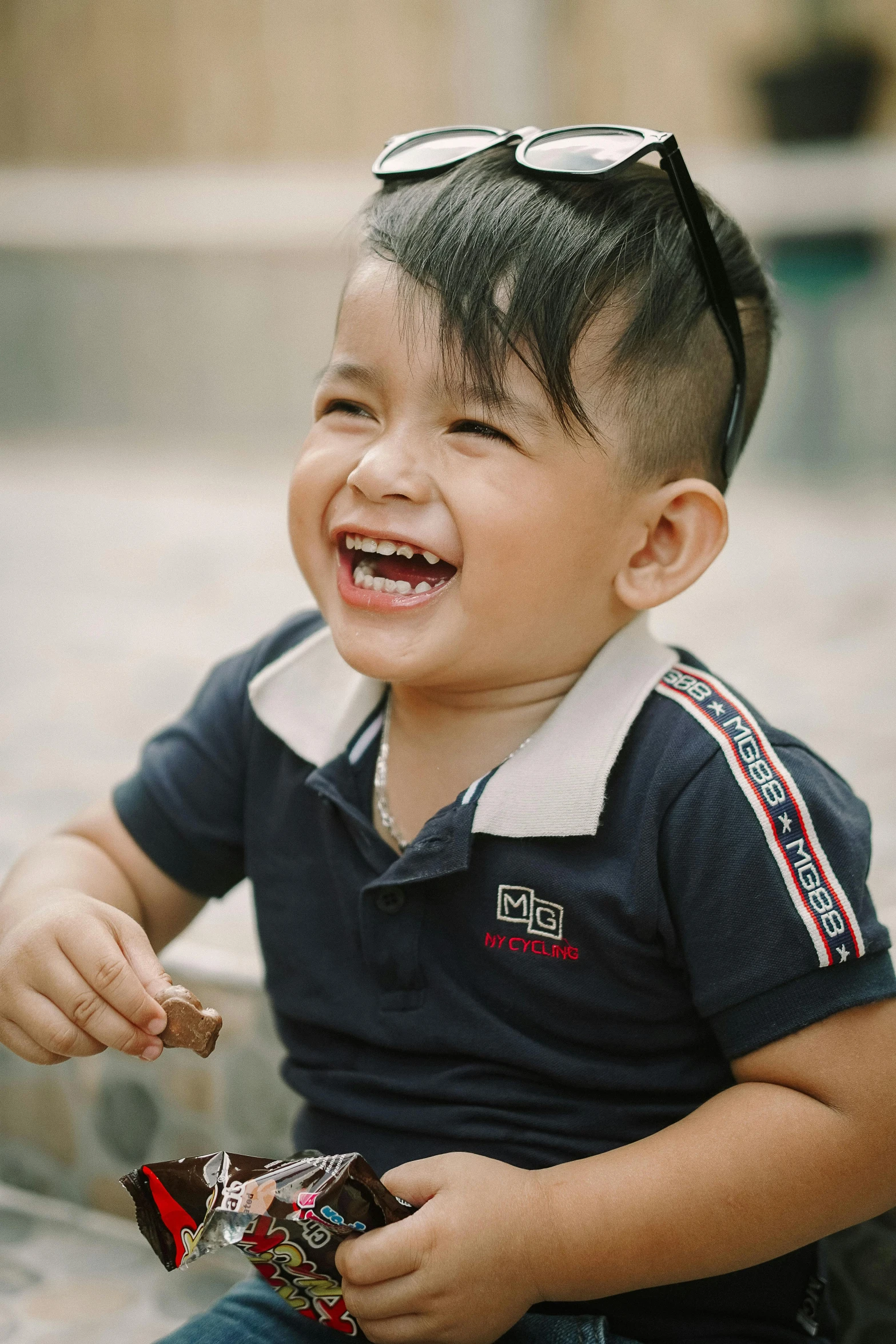 a little boy that is sitting down and smiling, pexels contest winner, happening, mai anh tran, earing a shirt laughing, combover, profile image