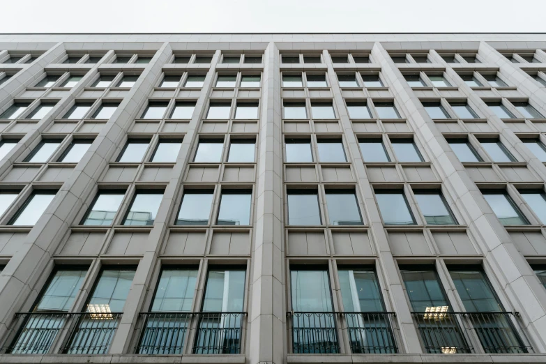 a very tall building with lots of windows, inspired by David Chipperfield, unsplash, square lines, afp, government archive photograph, large window