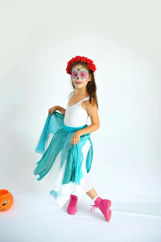 a little girl dressed up in a costume, inspired by Frida Kahlo, turquoise and venetian red, ghost mask, casual pose, teal orange