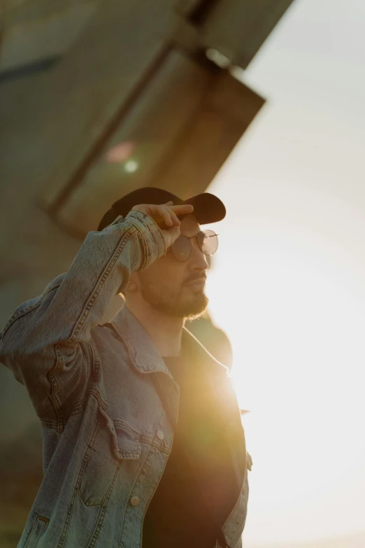 a man that is standing in front of a plane, unsplash, visual art, golden light film grain, portrait of sam hyde, sunfaded, music