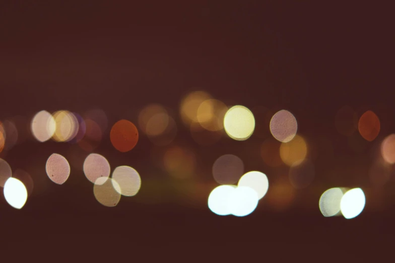 a blurry photo of a city at night, unsplash, overcast bokeh - c 5, bokeh”