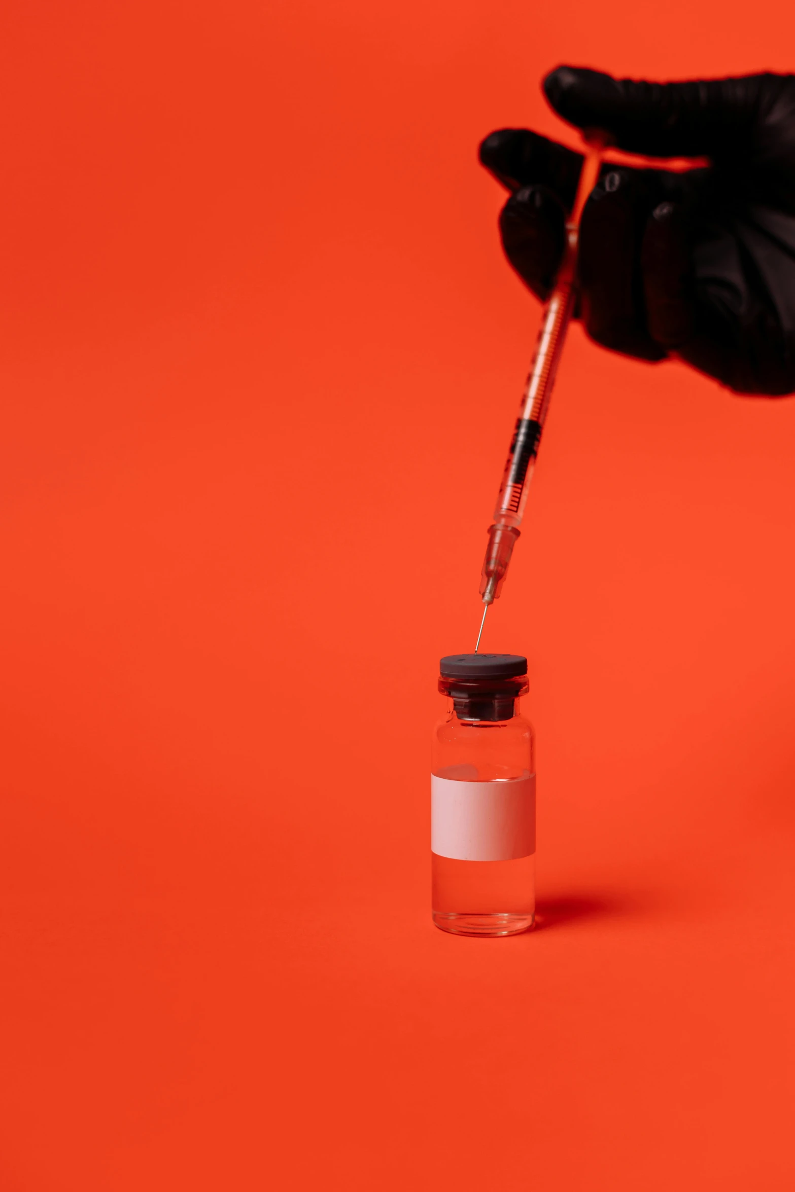a person in black gloves holding a vial filled with liquid, a picture, vermillion, iv pole, instagram picture, hero shot