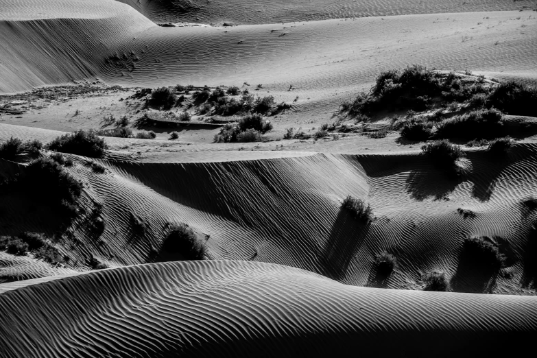 a black and white photo of sand dunes, by Matthias Weischer, pexels contest winner, middle eastern details, broken landscape, picturesque, megascans