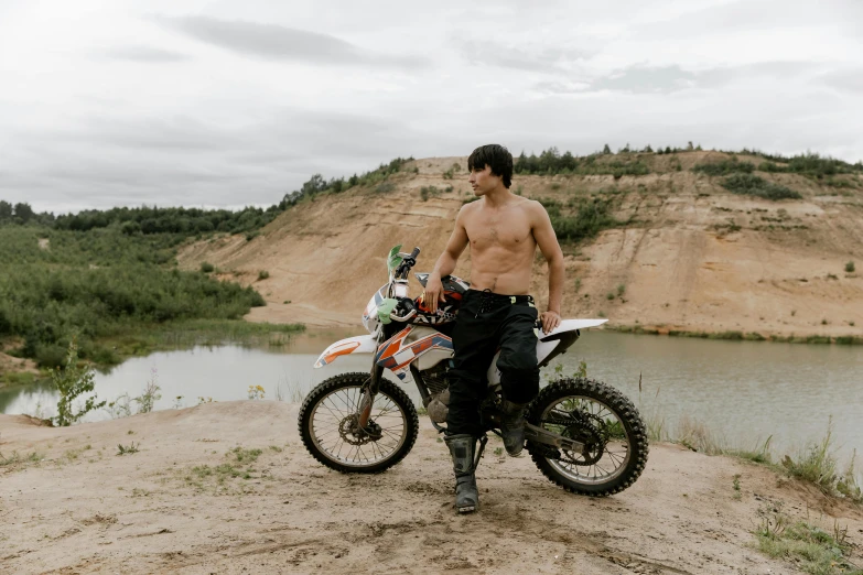 a shirtless man standing next to a dirt bike, pexels contest winner, figuration libre, azamat khairov, avatar image, without text, profile pic
