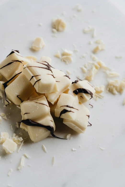 a white plate topped with sliced bananas and chocolate, soap, thumbnail, caucasian, whites