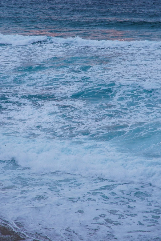 a man riding a surfboard on top of a wave covered beach, an album cover, trending on unsplash, minimalism, soft blue texture, turbulent sea, reefs, early evening