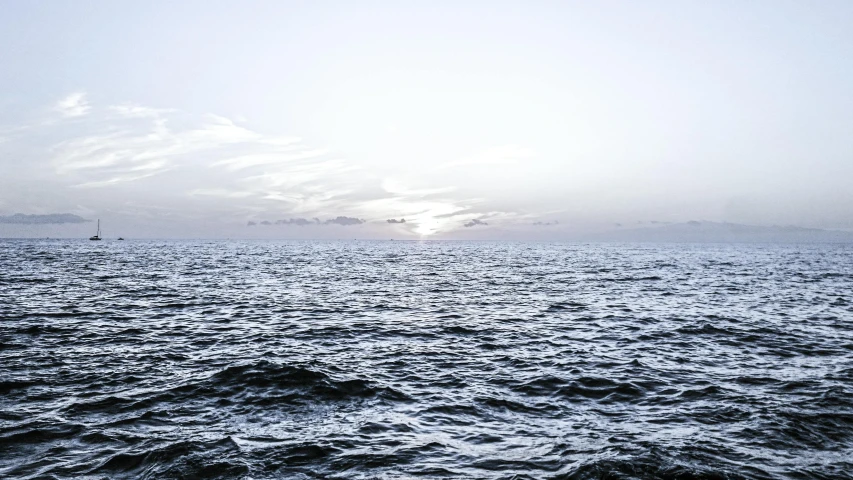 a large body of water with a boat in the distance, an album cover, unsplash, romanticism, peter hurley, fades to the horizon, distant horizon, checkerboard horizon