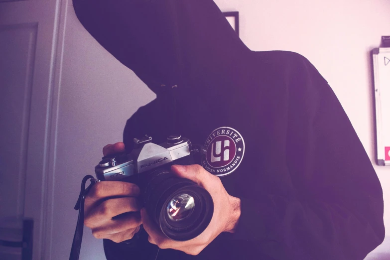 a person in a hoodie holding a camera, a picture, ((oversaturated)), profile pic, ((sharp focus)), ultra definition