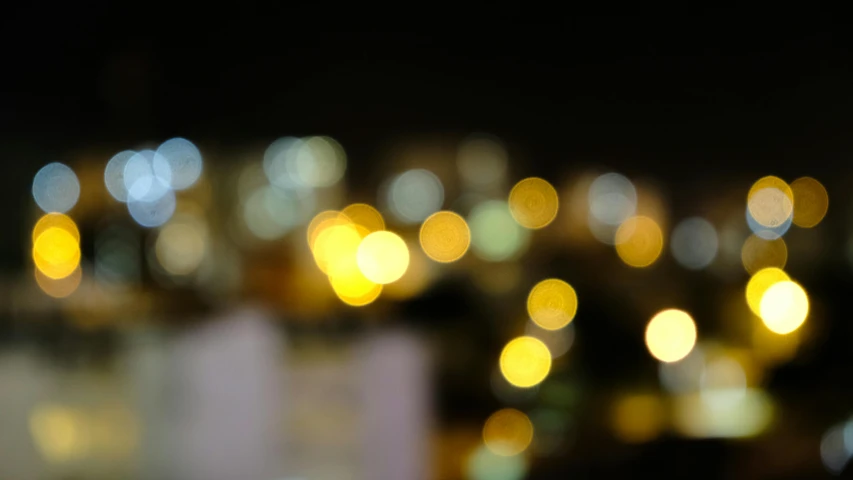 a blurry photo of a city at night, unsplash, minimalism, overcast bokeh - c 5, macro bokeh ”, yellowish light, bokeh”