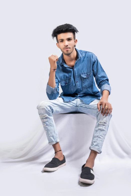 a man sitting on top of a white chair, inspired by Saurabh Jethani, pexels contest winner, photorealism, wearing jeans, confident pose, androgynous, white background : 3